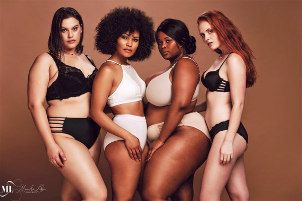 Proud group of women in lingerie posing together | Delicate Beauty