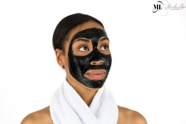 Woman with a charcoal face mask  - ML Delicate Beauty