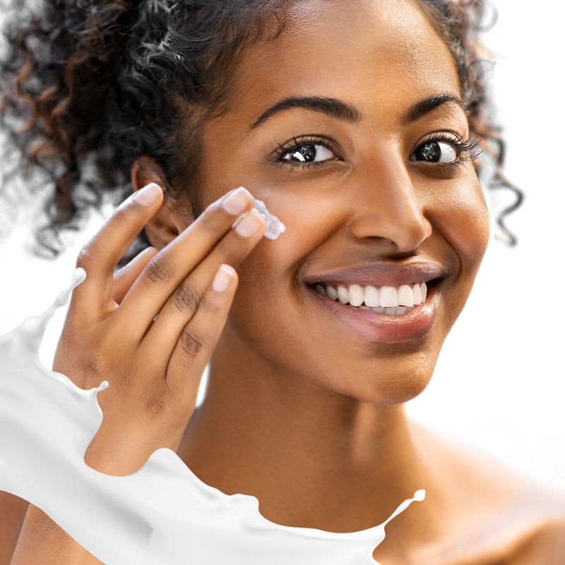 Black woman using facial cream from ML Delicate Beauty
